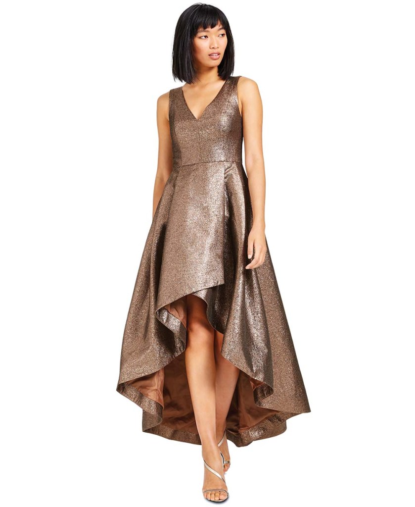 a model in a shiny bronze dress